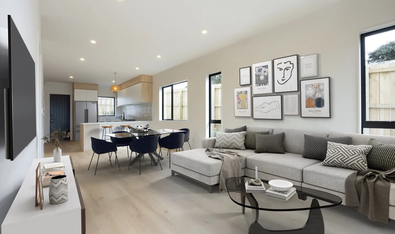 Open plan living and dining area in an Eden Group home at 12-14 Taupo Street, Green Bay.