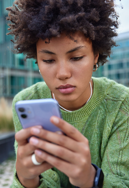 A woman looking at her phone