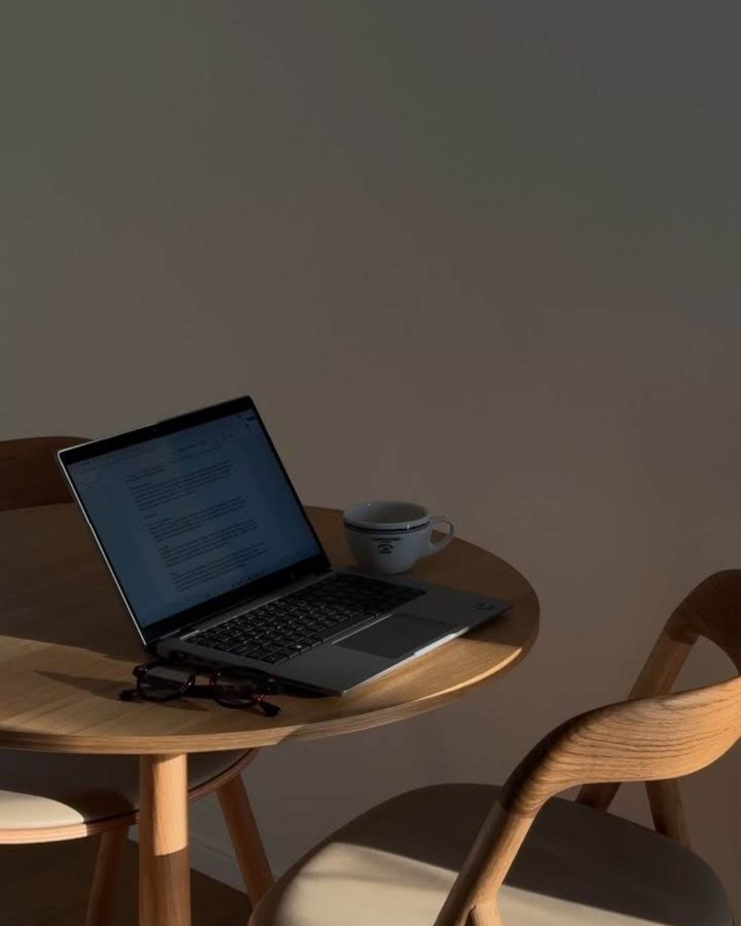 A self-employed client reviewing their accounts with an adviser