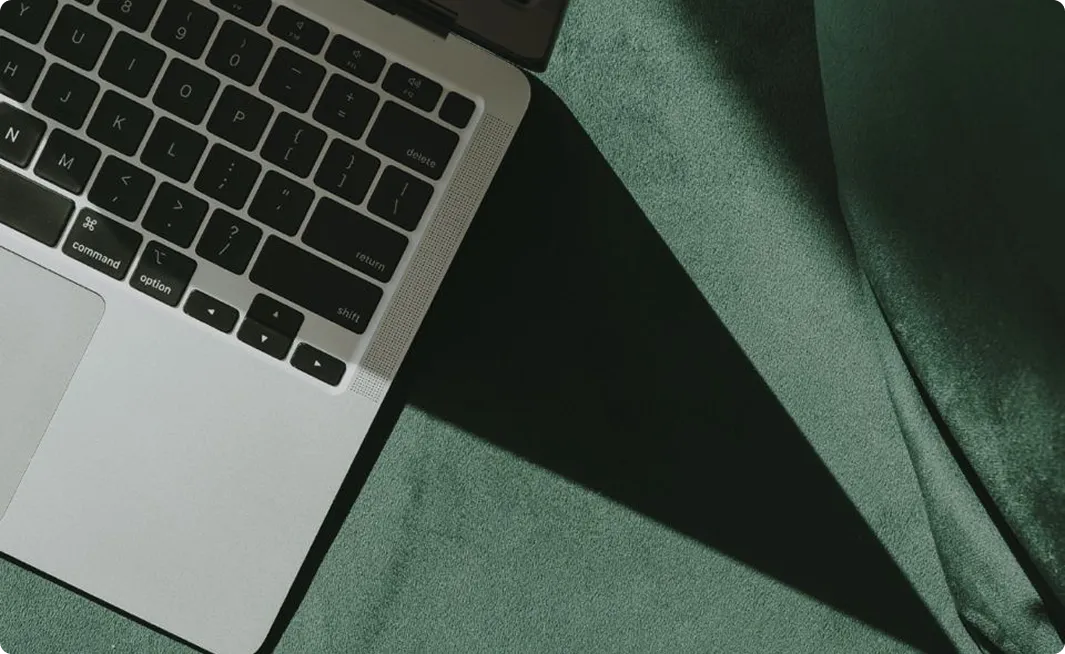 Laptop keyboard on a green surface