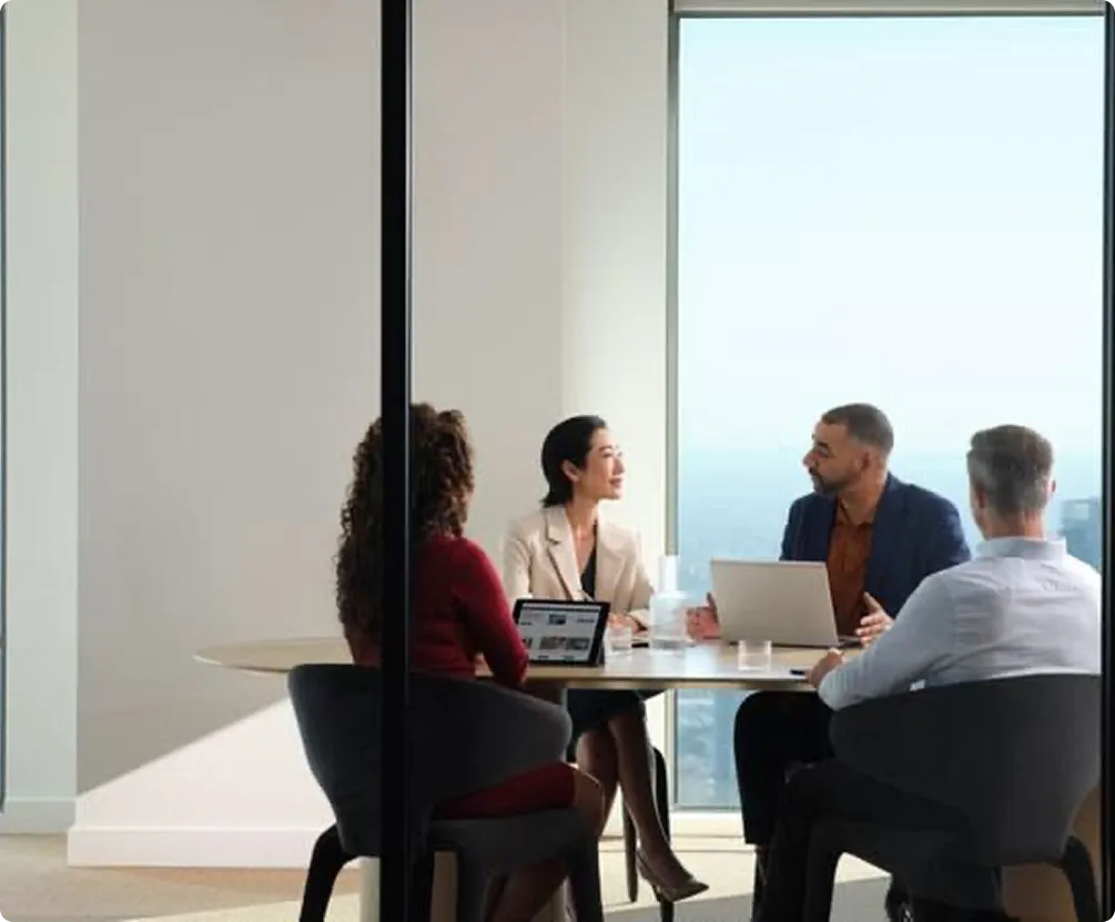 Business team meeting in a glass conference room