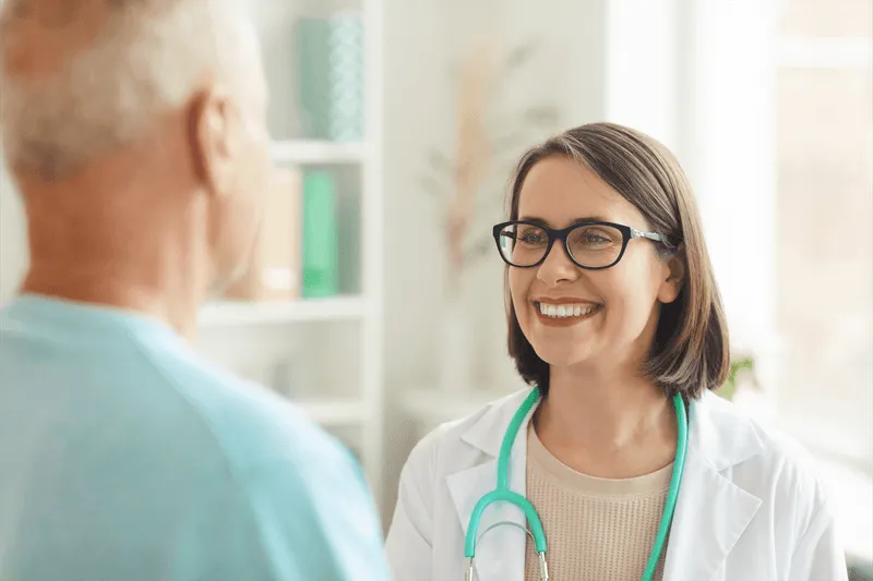 a doctor smiling at a patient