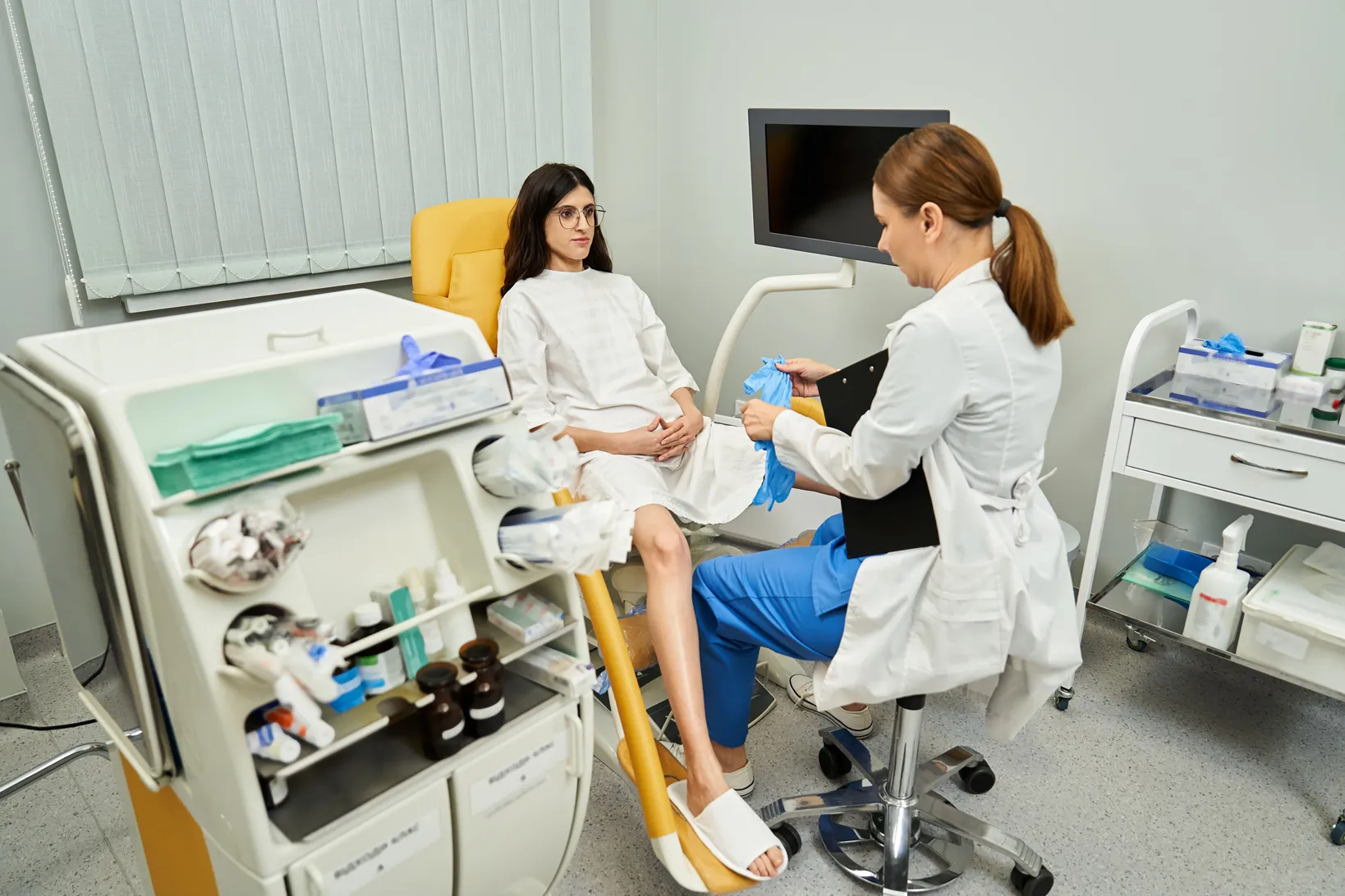 obstetrician gynecologist and her client in the doctor's room