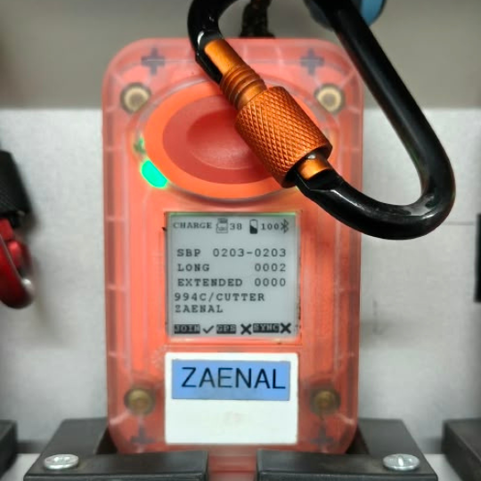 Handheld field device showing a worker's GPS-verified harvest data and ID