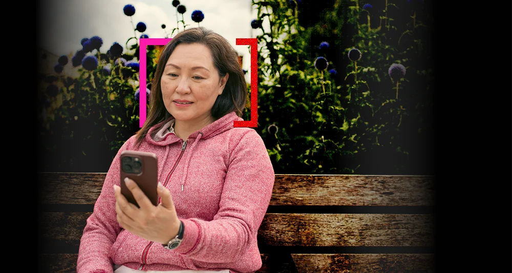 Woman in a pink hoodie checks her smartphone on a park bench, with a “Financial health checkup” graphic showing a score of 72.