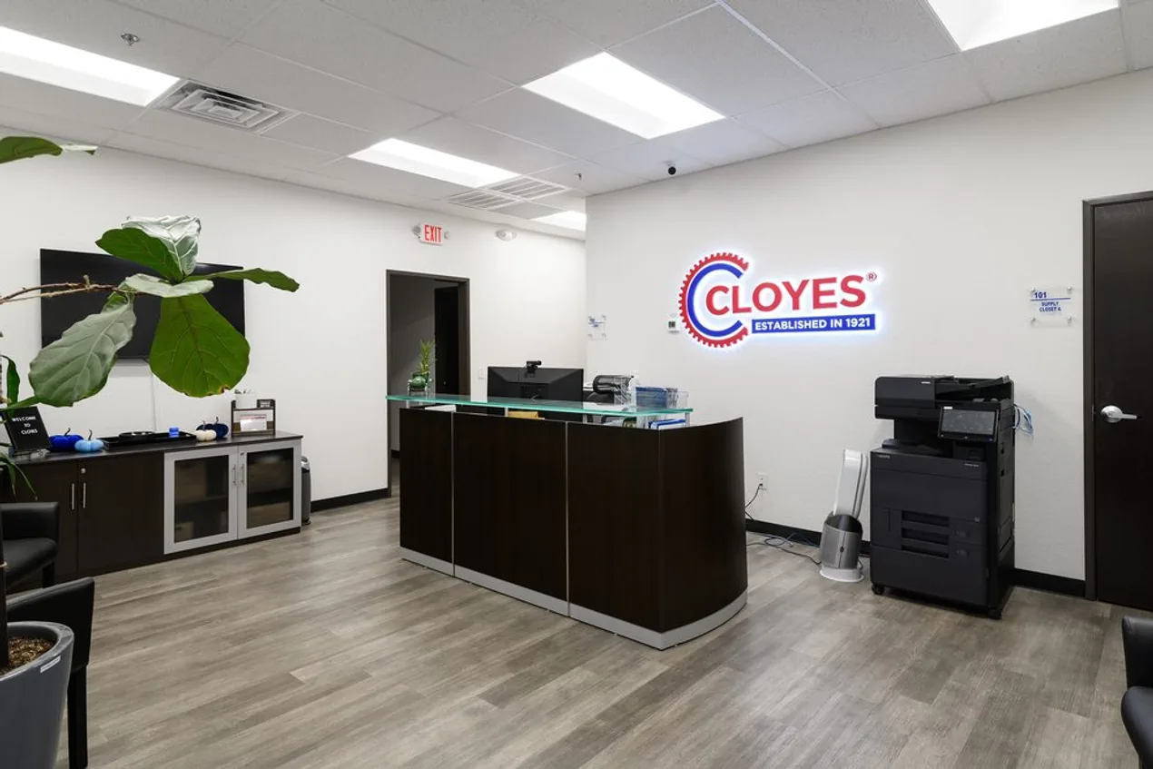 Interior reception area of a Cloyes facility with the ATI-branded Cloyes sign on the wall