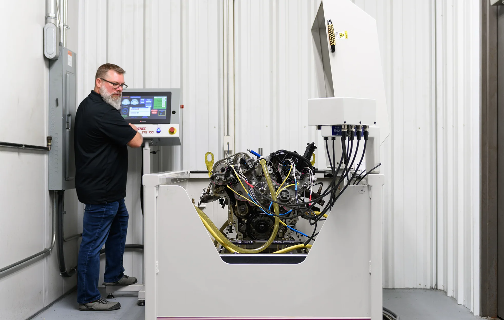 Engineer running a timing system on an engine dynamometer test cell