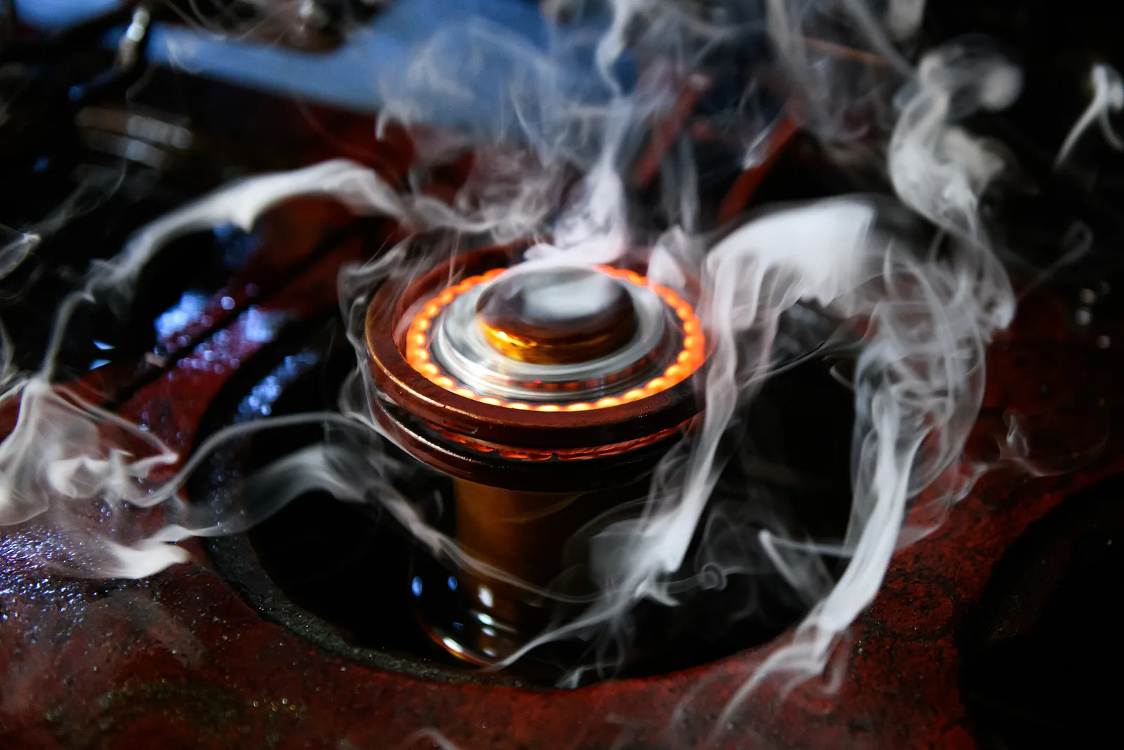 Glowing high performance timing sprocket under load in a racing engine