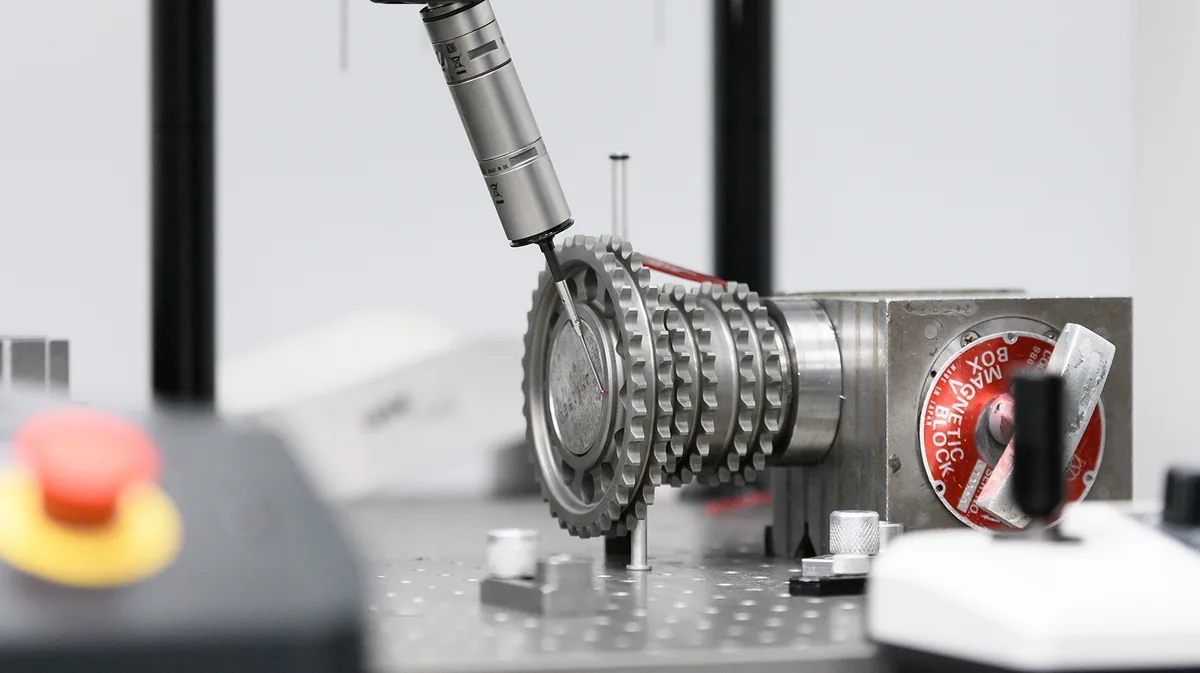Probe measuring a stack of timing sprockets on an inspection fixture