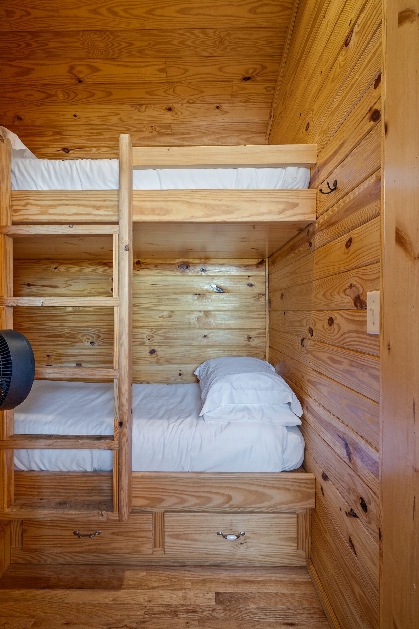 Built-in pine bunk beds with storage drawers underneath