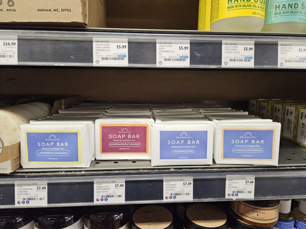 Benevolence Farm soap bars on a shelf at Weaver Street Market