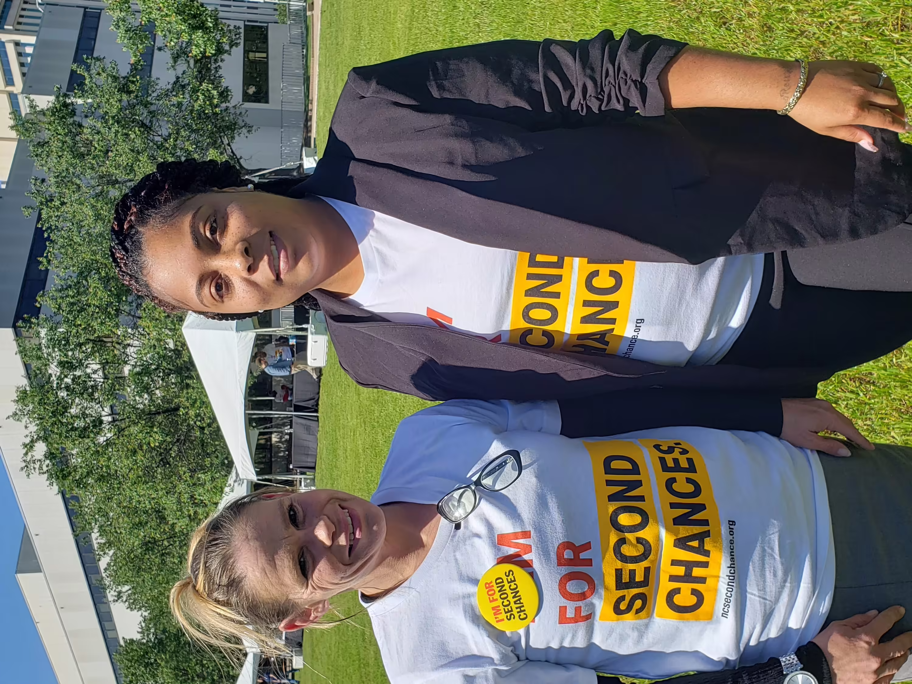 Two people wearing I am for second chances shirts