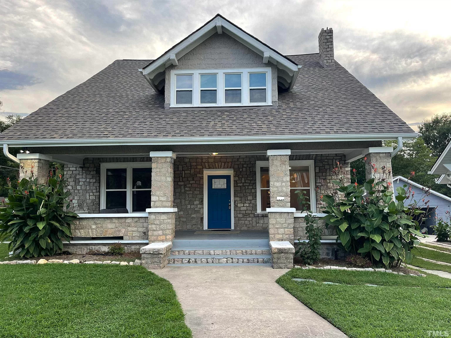 A craftsman-style house with a front walk, the second Benevolence Farm home