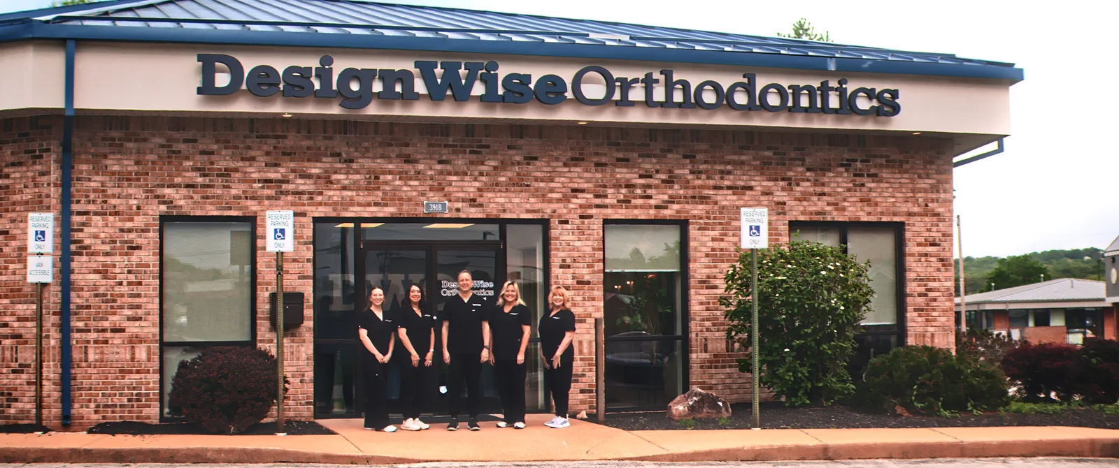 The DesignWise Orthodontics team outside the Festus office