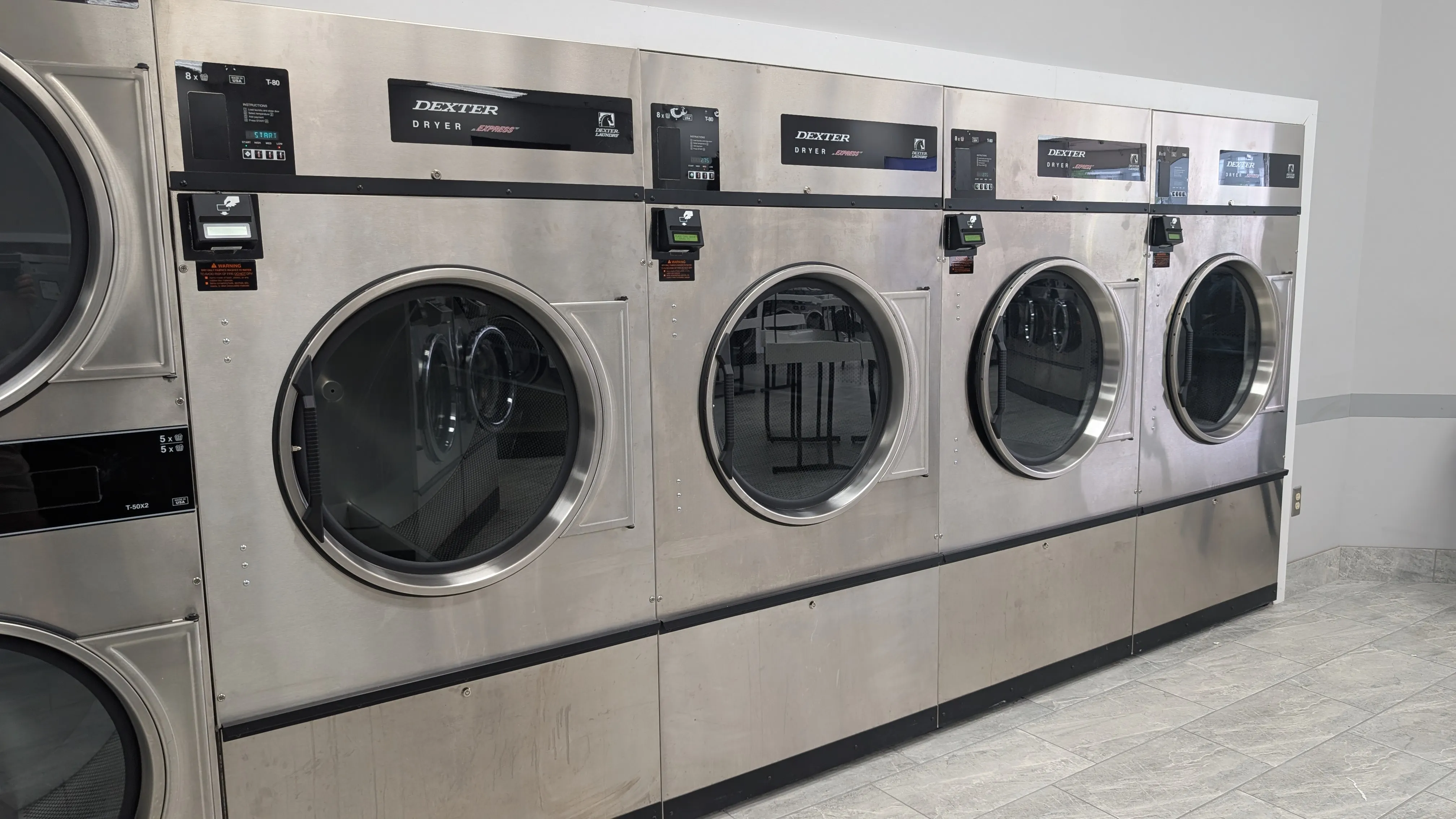Row of large Dexter dryers at Lafayette Laundromat