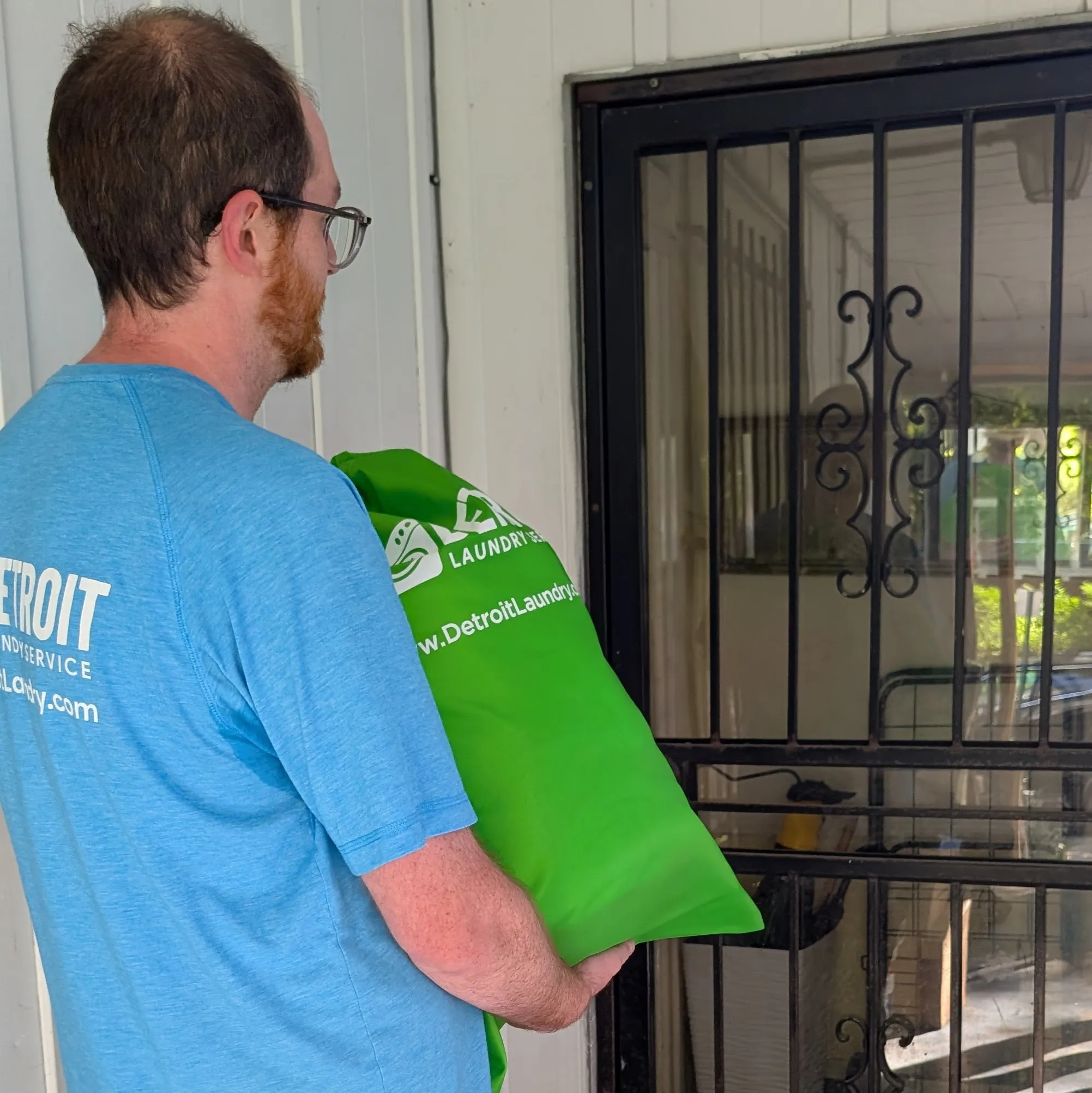 Laundry delivery bag left at a customer door