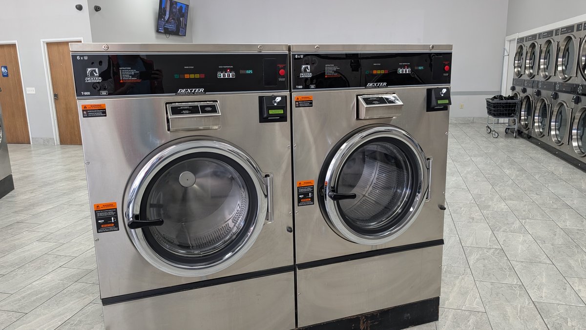 Two large-capacity Dexter T-900 commercial washers at Lafayette Laundromat in Detroit