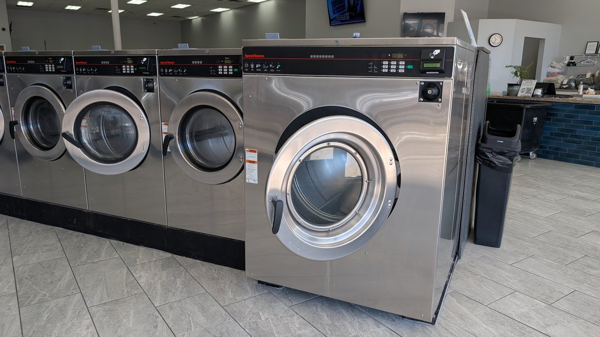 Speed Queen washer row beside the service counter at Lafayette Laundromat