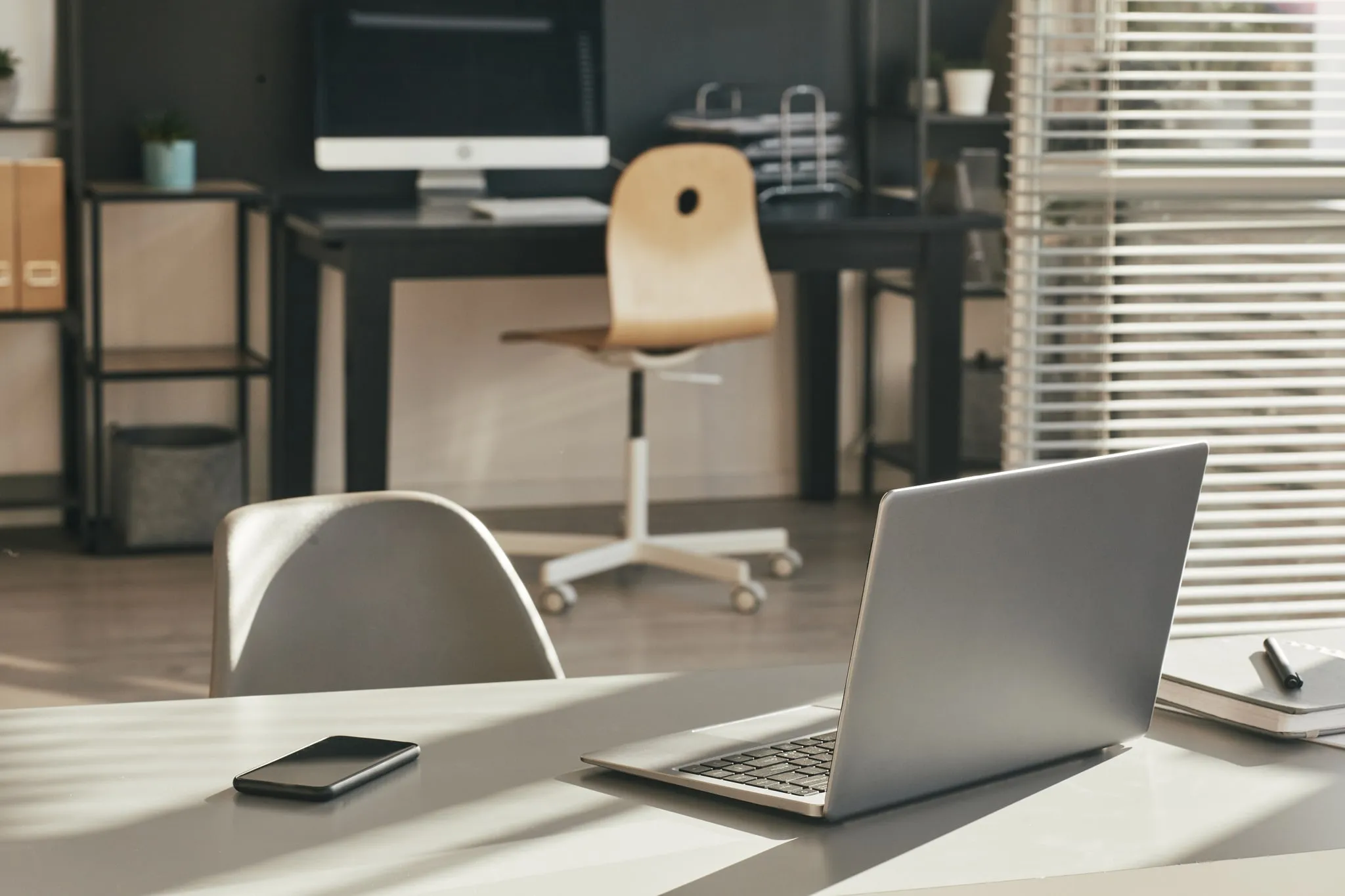 Desk with laptop and phone
