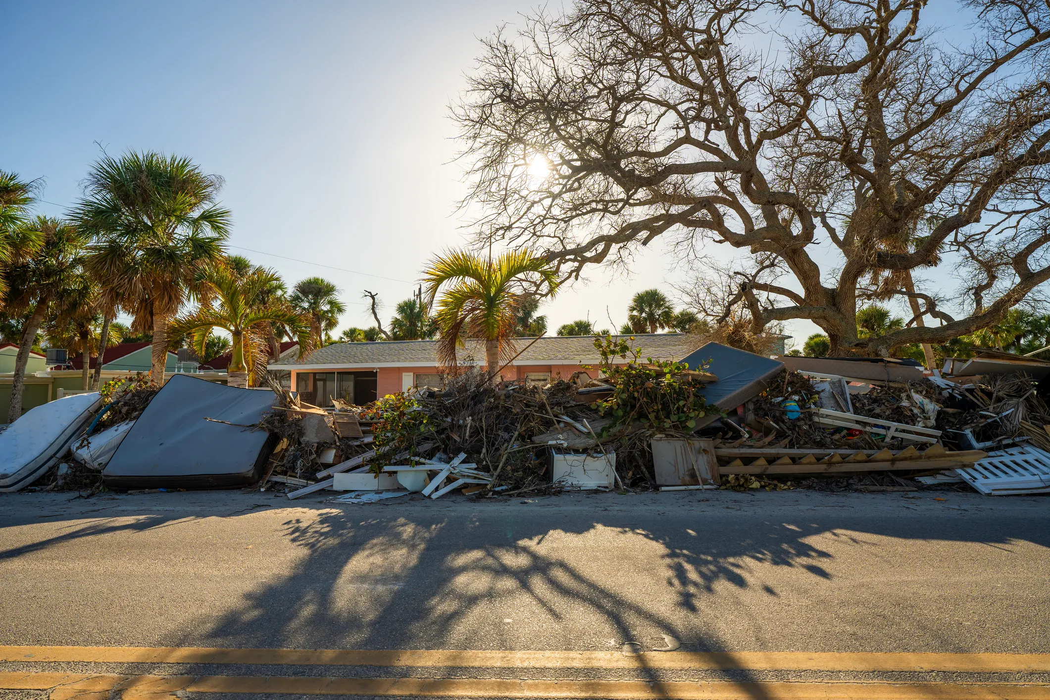 Storm debris piled along a residential street