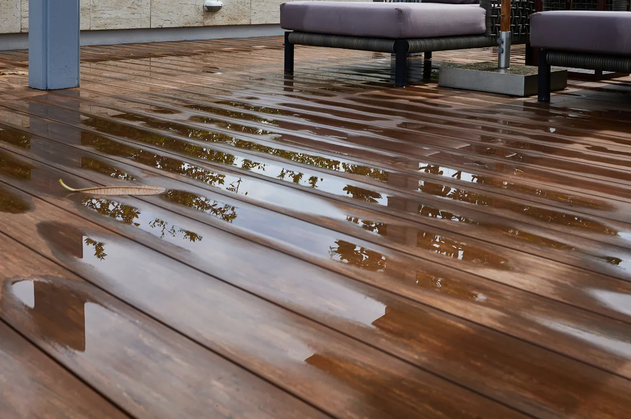 Standing water on a wood floor after a flood