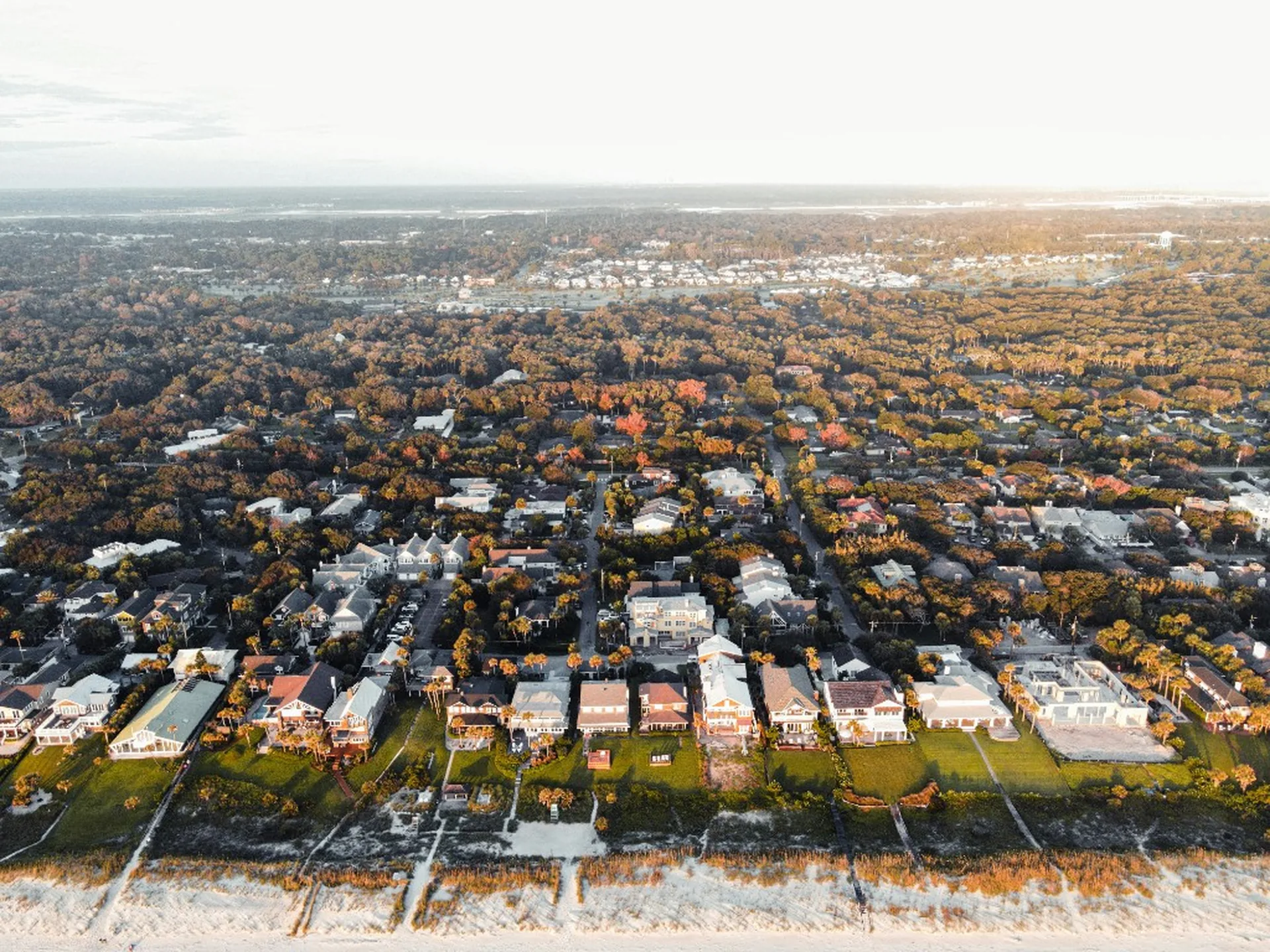 Aerial view of oceanfront homes and dunes in Atlantic Beach, Florida