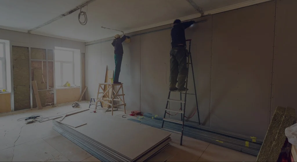 Crew installing drywall during interior reconstruction in Jacksonville after water, fire, or mold damage