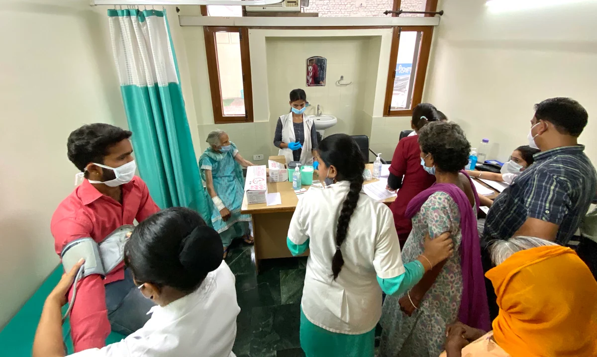 A clinician meeting patients at Prabh Aasra's hospital.