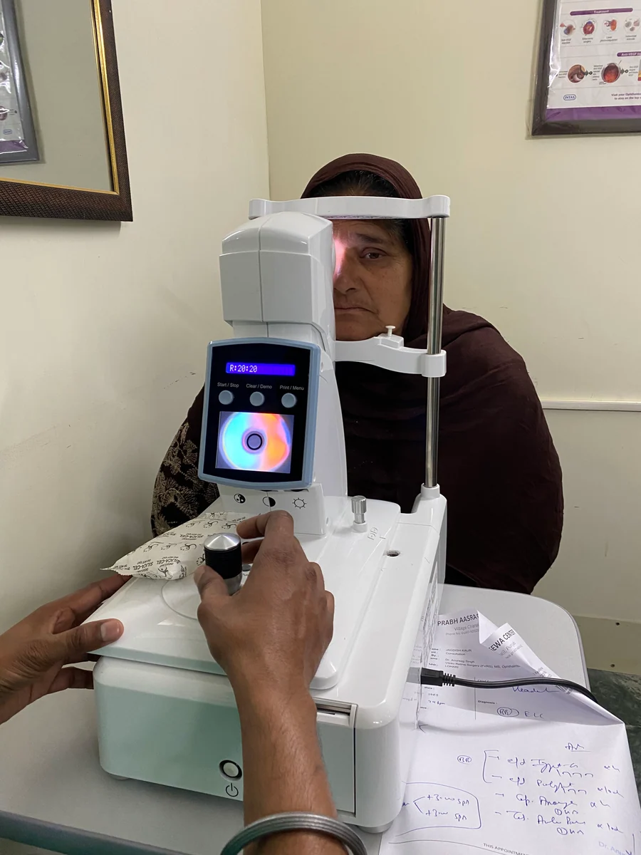 A patient receiving an eye examination at Prabh Aasra.