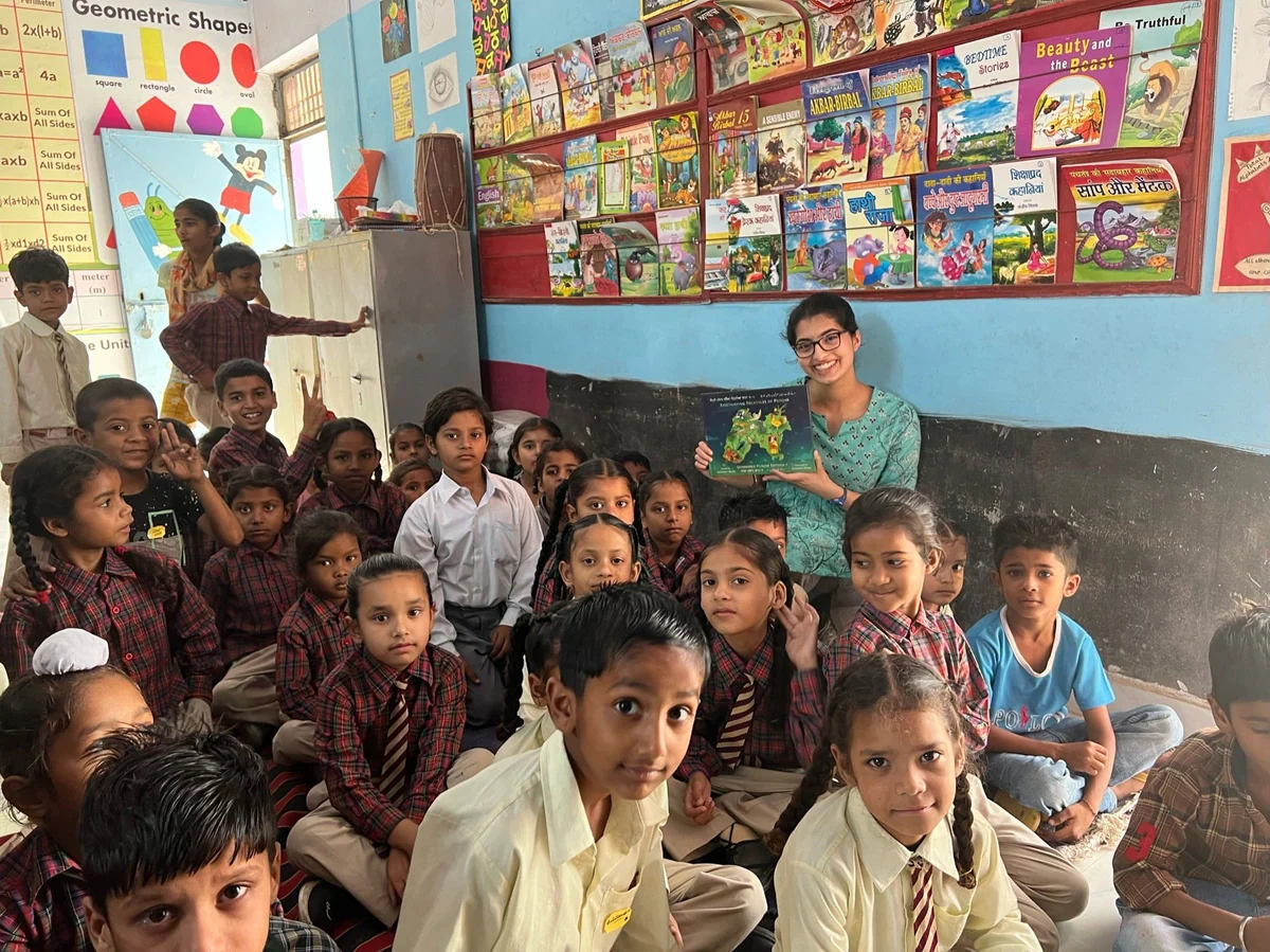Children and their teacher together in a PIPPAL classroom.