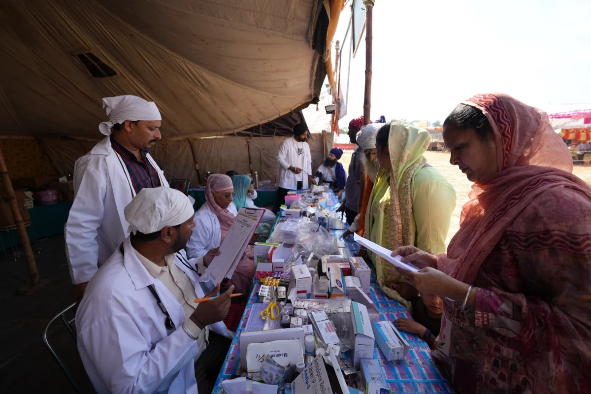 A patient speaking with medical staff at an outreach clinic.
