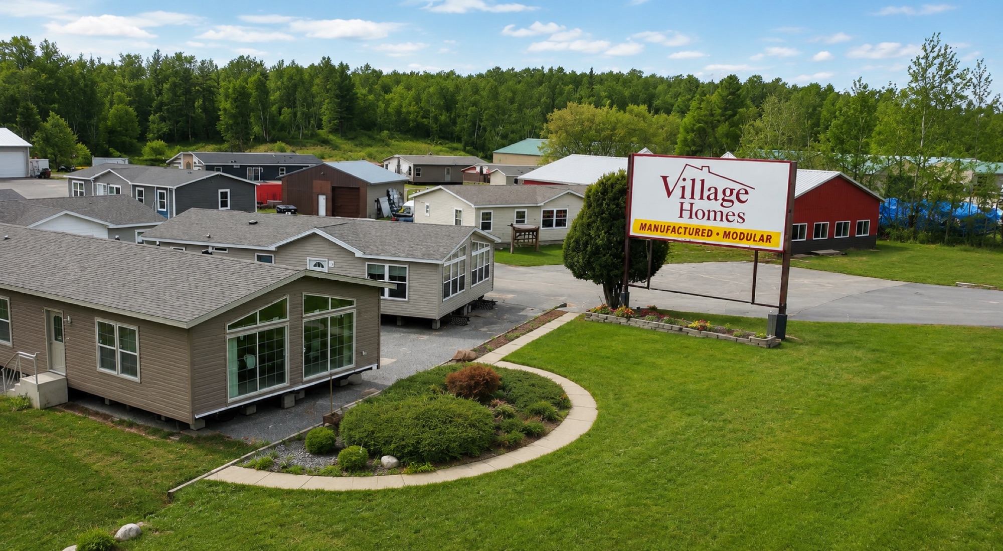 Aerial of the Village Homes Walker lot with model homes and signage