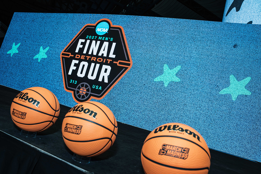 Photo of 3 Wilson basketballs on display with a "Final Four" logo behind them.