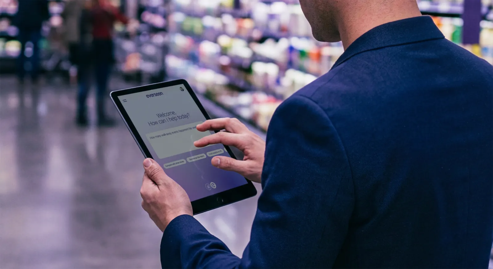 Retail manager asking an AI assistant a question on a tablet