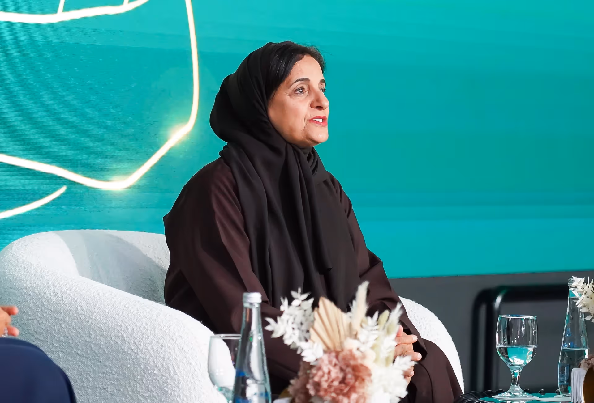 Emirati Women’s Day speaker on stage.