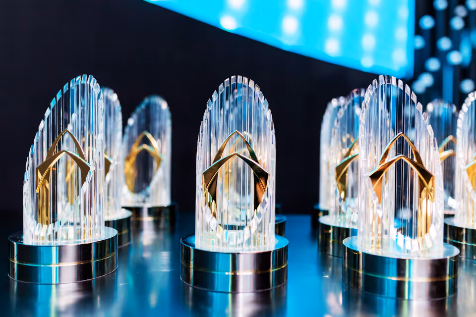 Crystal trophies displayed at an event.