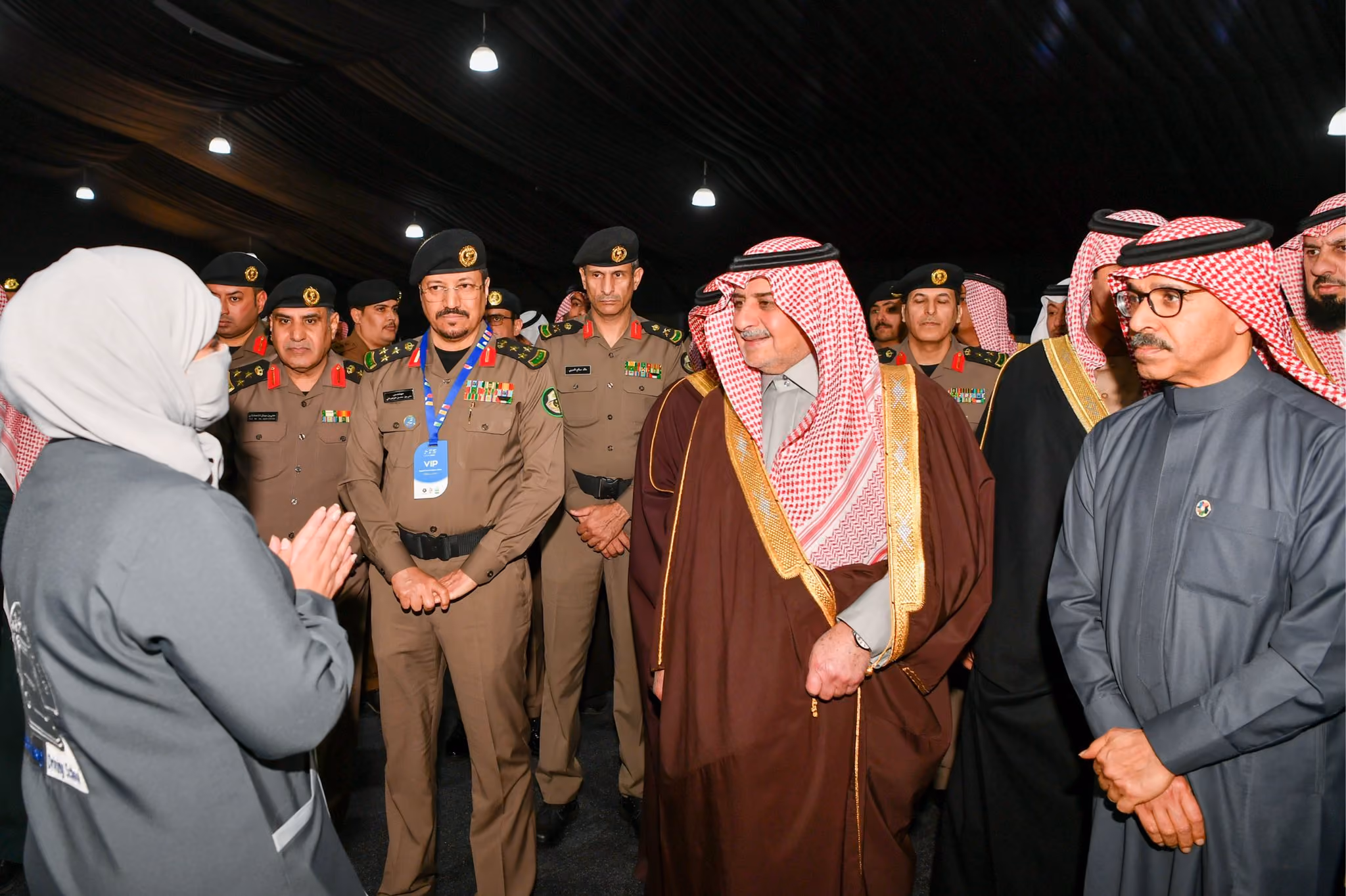 Saudi officials and dignitaries touring an exhibition event.