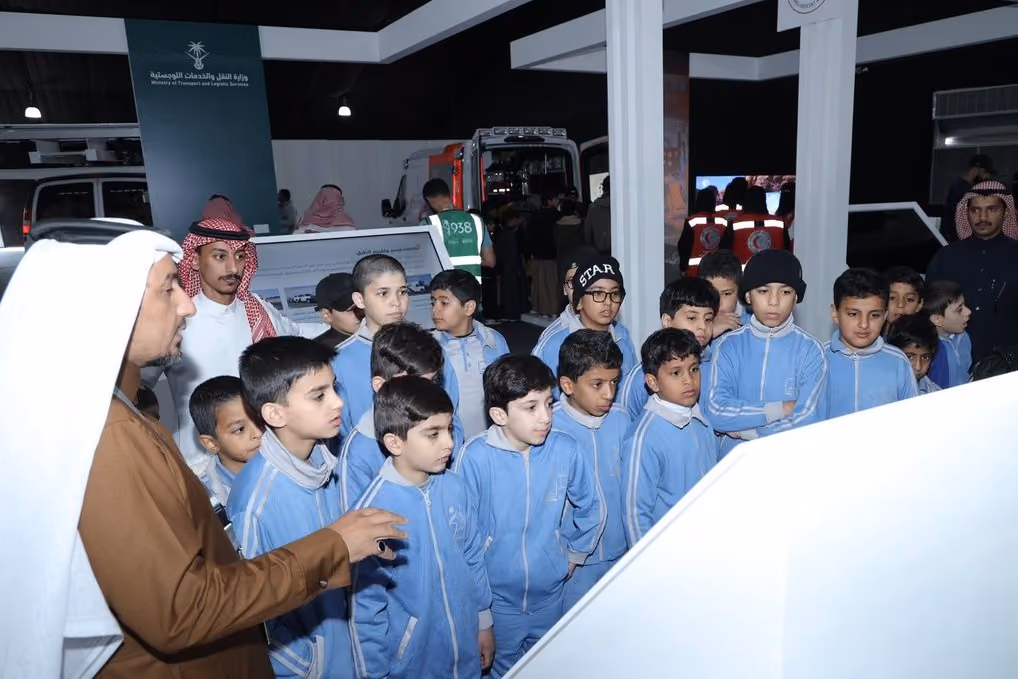 Children visiting an interactive exhibition at a government event.