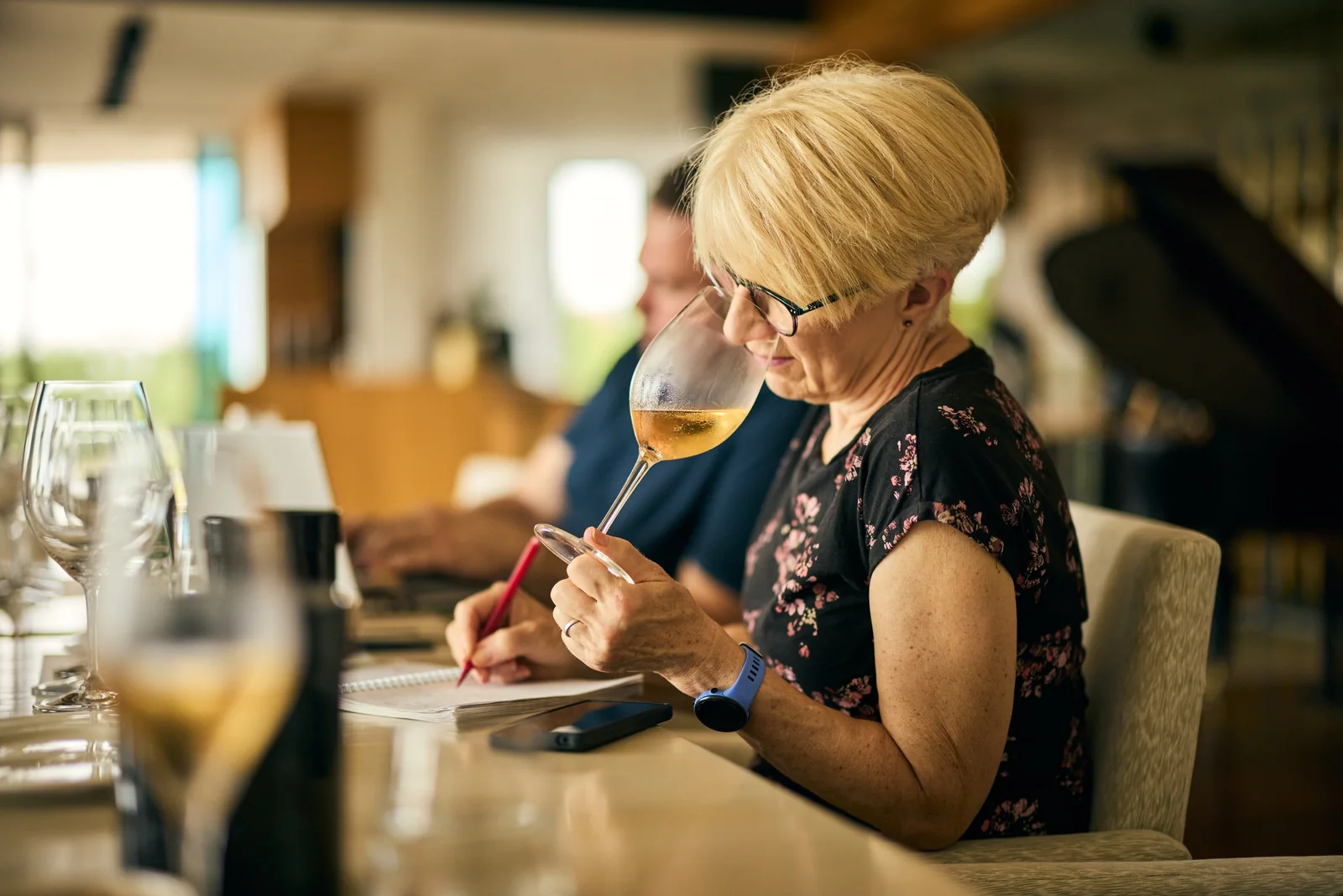 Tasting notes taken over a glass of white, brand photography for a winery
