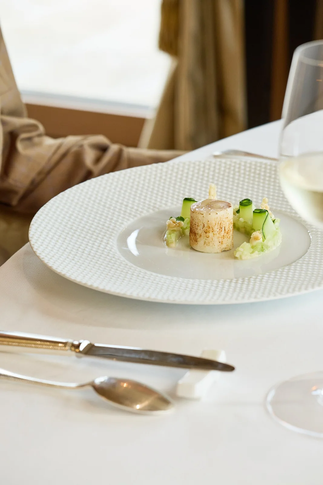 Amuse-bouche on a laid table by the window, restaurant photography for a fine dining venue