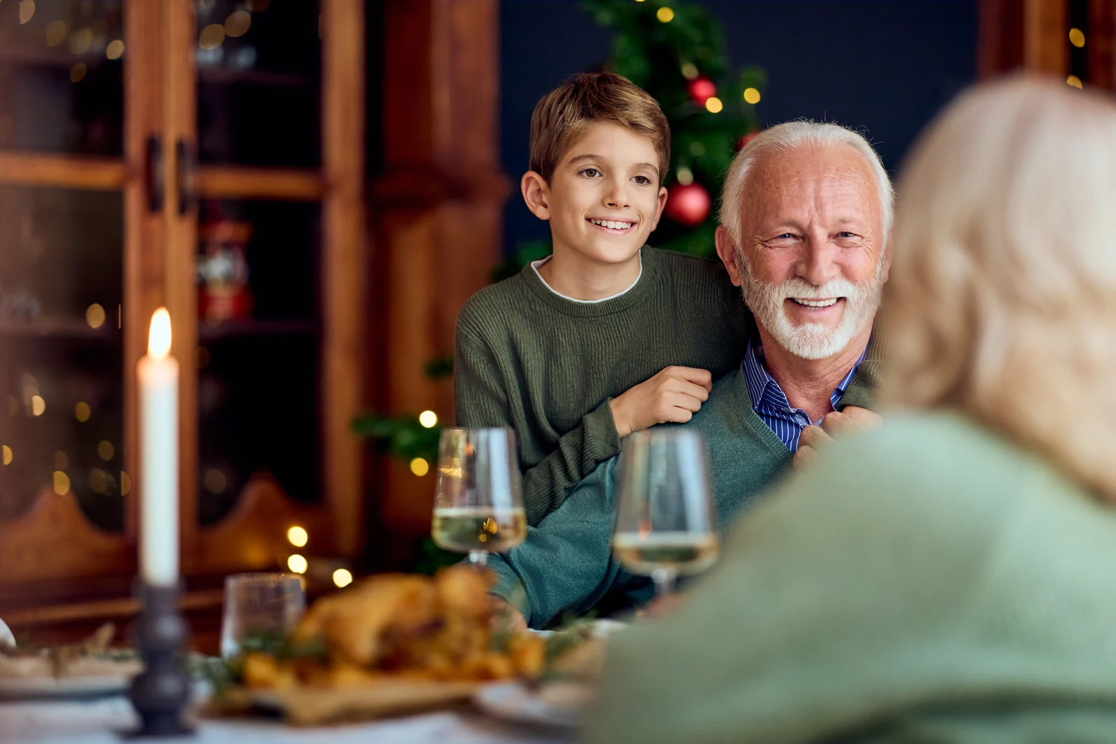 Grandfather and grandson at the festive table, brand photography for a hospitality venue