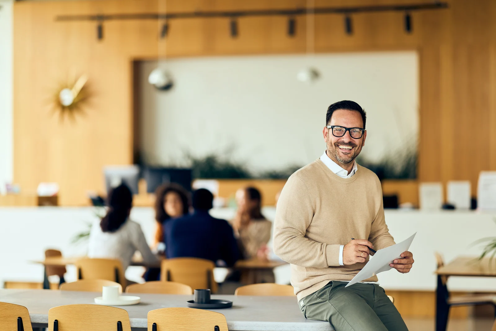 Executive in the office cafeteria, business portrait for a professional services firm