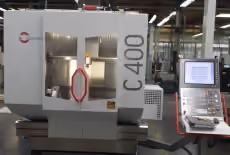 Machining centre spindle working a tool component