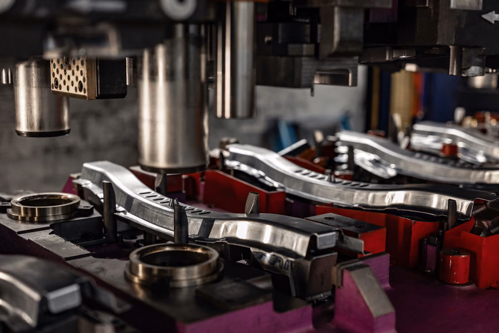 Progressive press tool with formed automotive sheet-metal parts