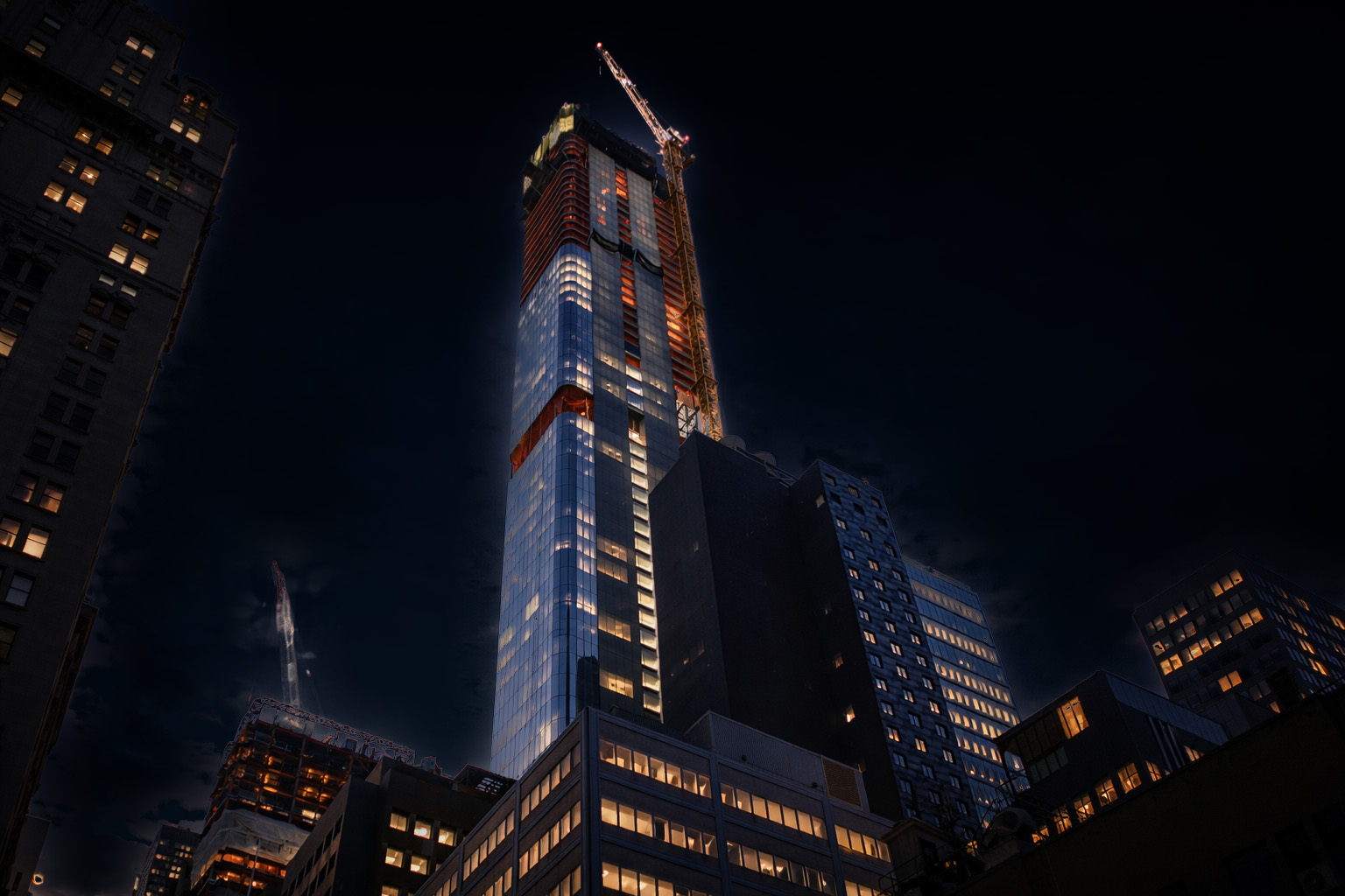 Supertall tower under construction at night