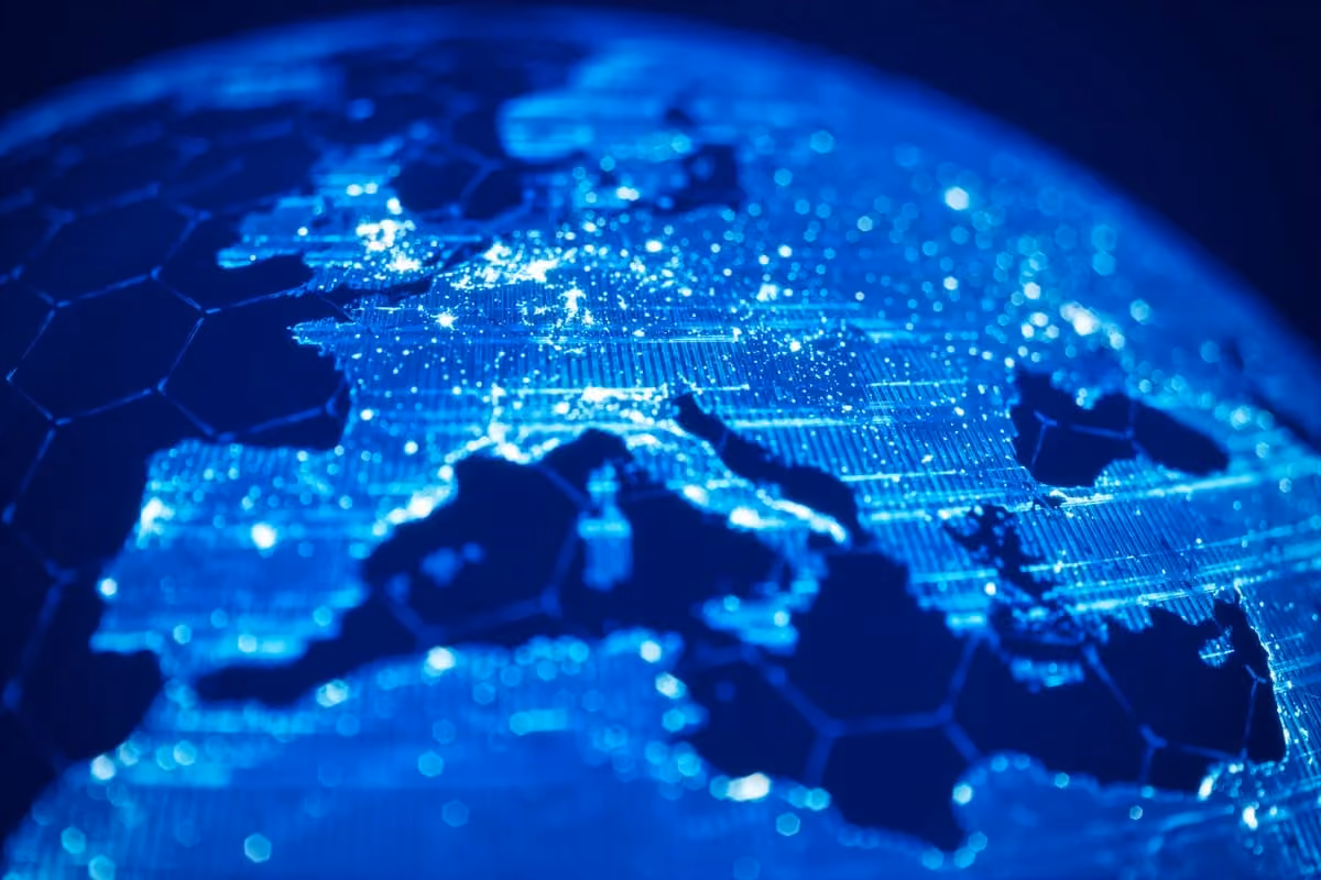 Digital glowing map of Europe and parts of nearby regions in blue with hexagonal grid overlay.
