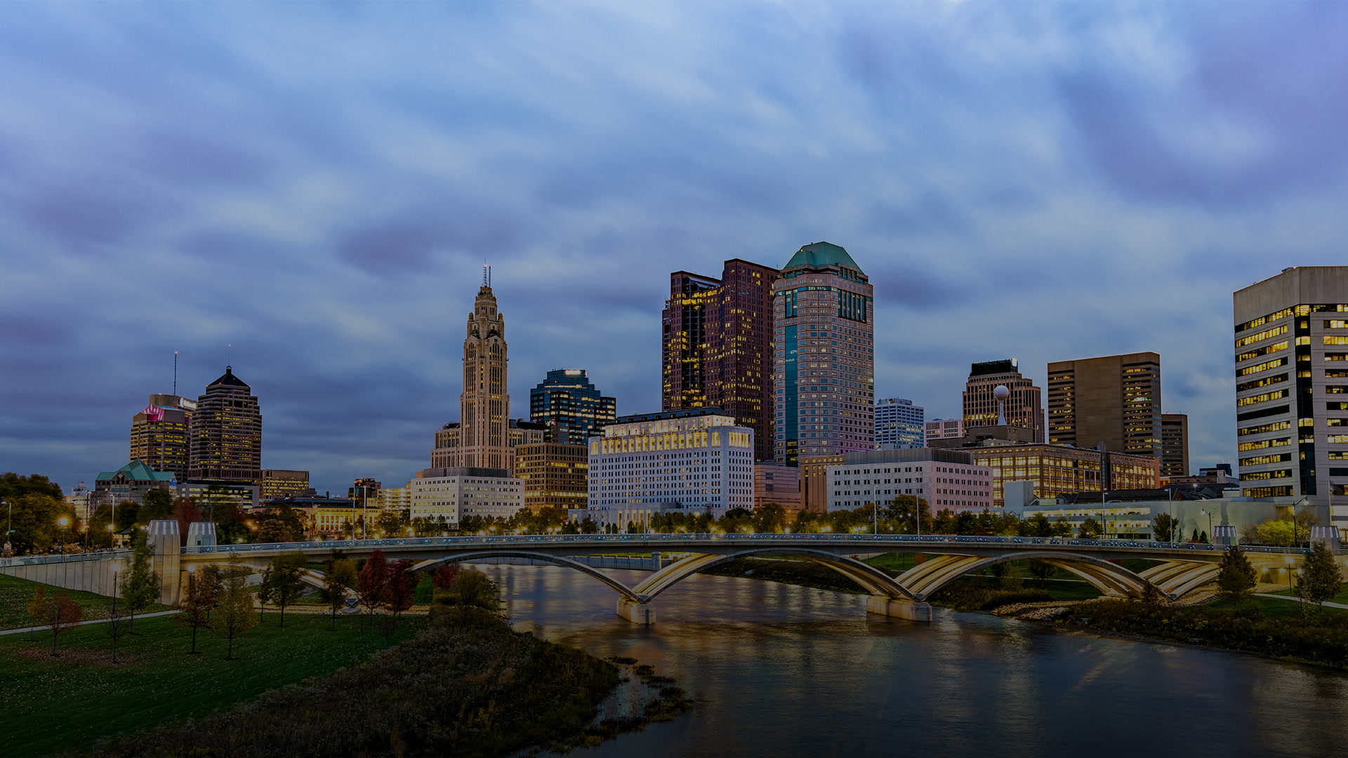 The Columbus, Ohio skyline at dusk across the river, near the NorthRock Partners office