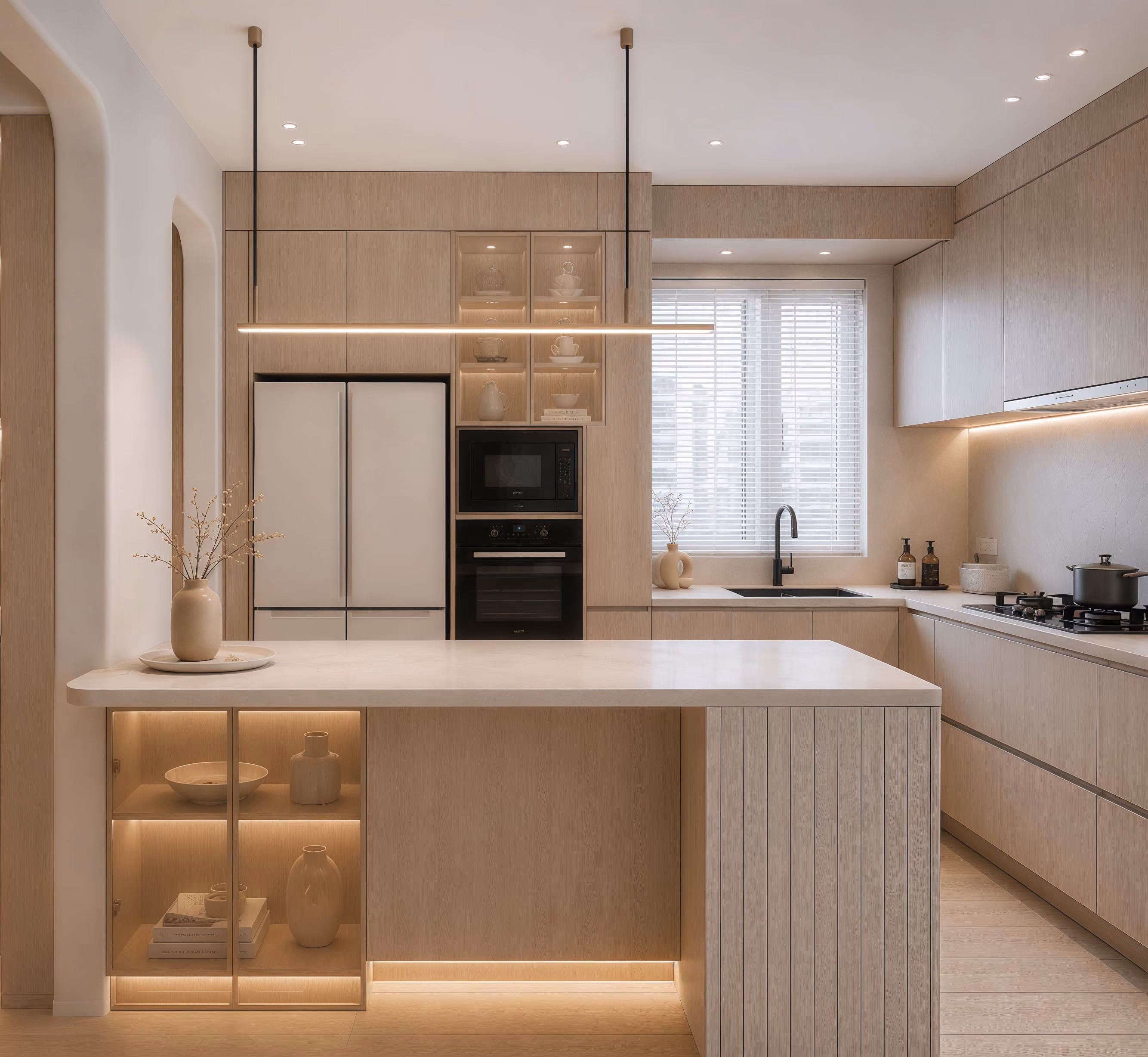 Bright kitchen with pale timber cabinetry, an island and integrated appliances.