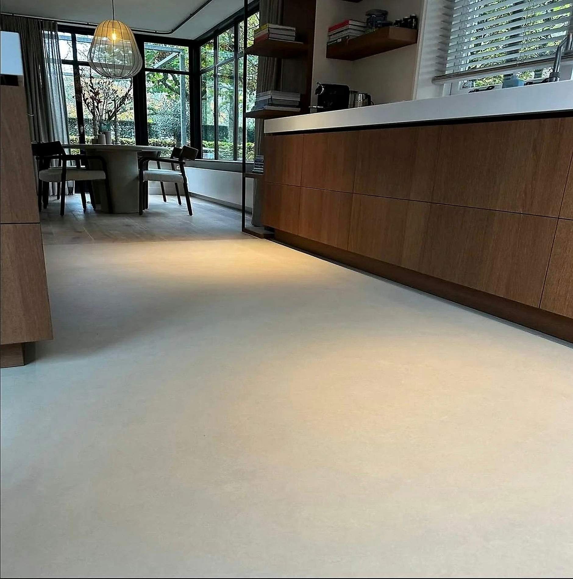 Continuous floor running through a kitchen and hallway