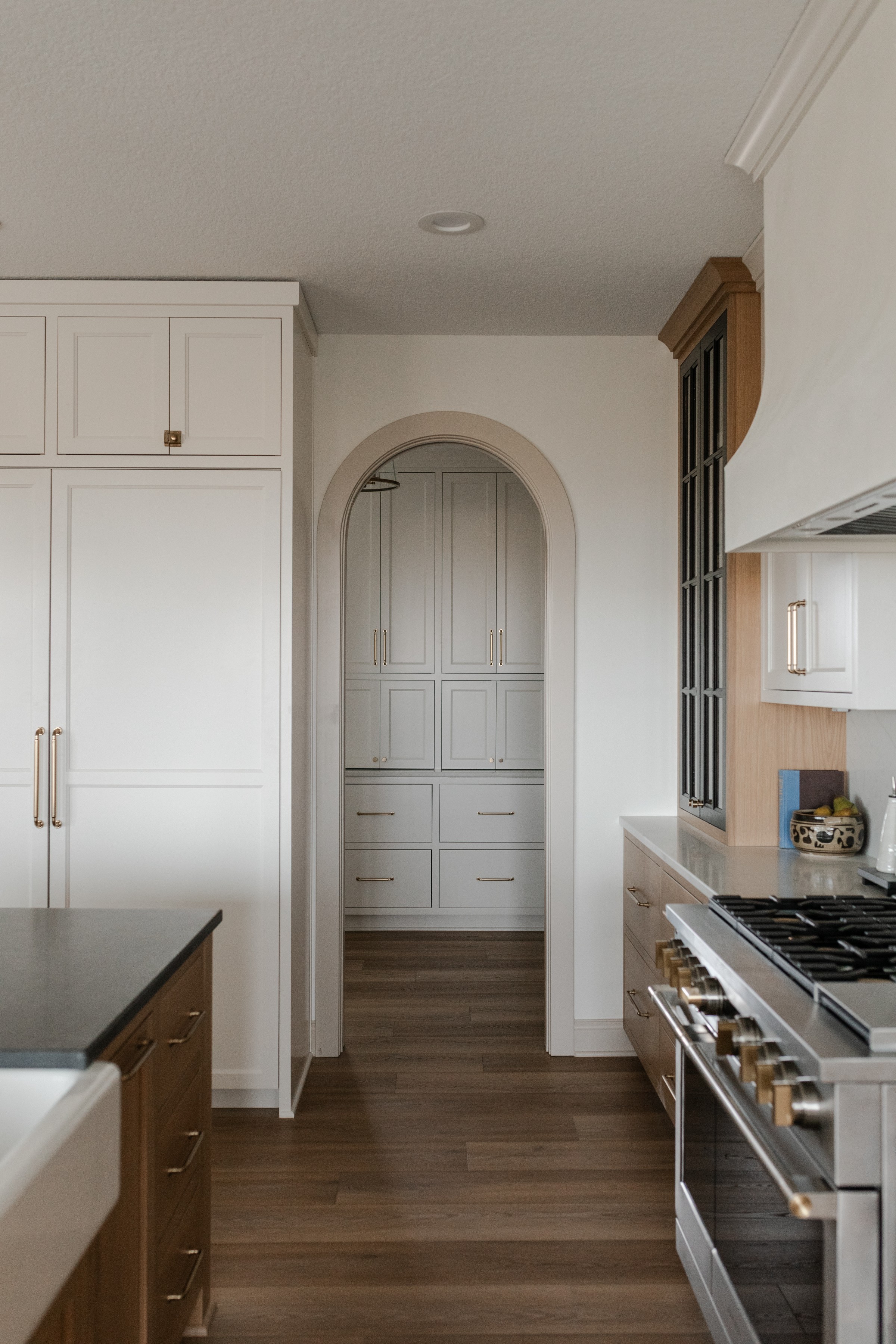 Mudroom with shiplap, bench and brass lighting